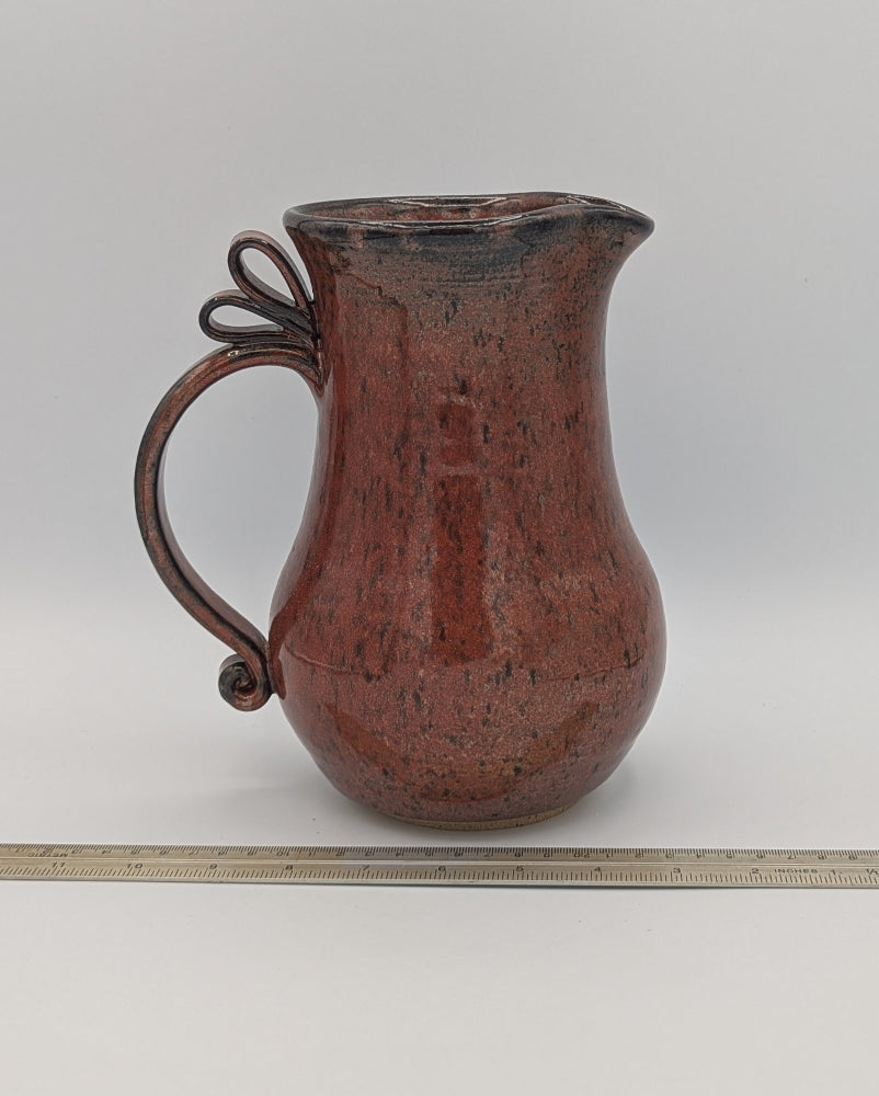 Artisan Handcrafted Pitcher with Decorative Handle in Rich Rust Glaze
