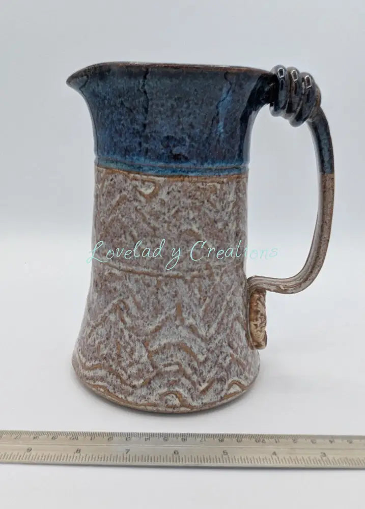 Robust Handcrafted Ceramic Pitcher with Textured Body and Cobalt Blue Rim Pitcher