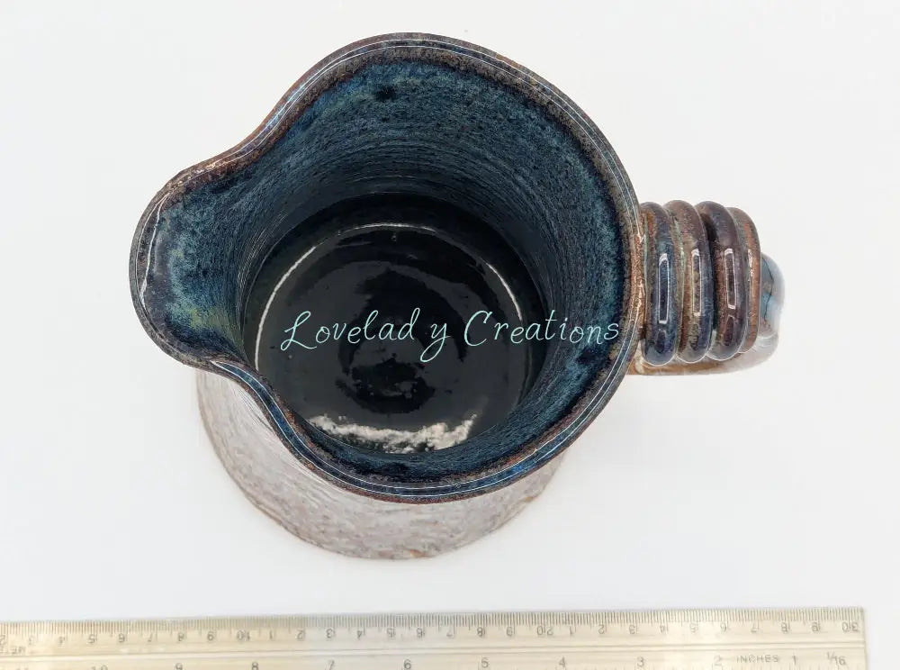 Robust Handcrafted Ceramic Pitcher with Textured Body and Cobalt Blue Rim Pitcher